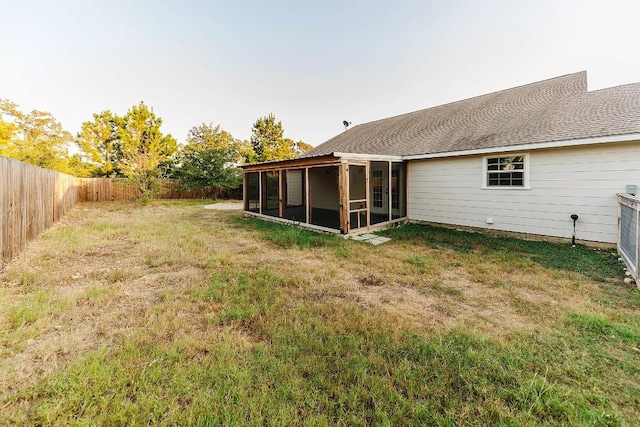 view of yard featuring a sunroom