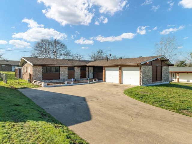 single story home featuring a garage, driveway, stone siding, fence, and a front yard