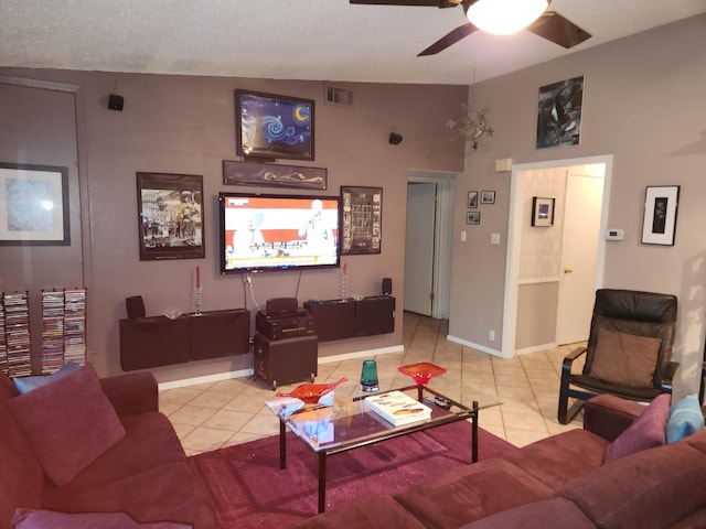 living room featuring lofted ceiling, light tile patterned floors, a textured ceiling, and ceiling fan