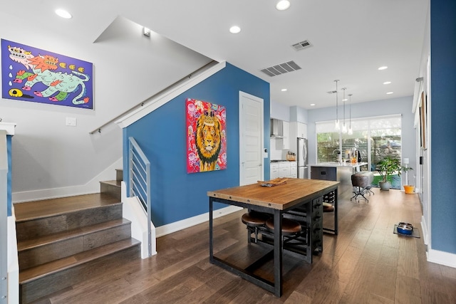 dining space with stairway, visible vents, and baseboards