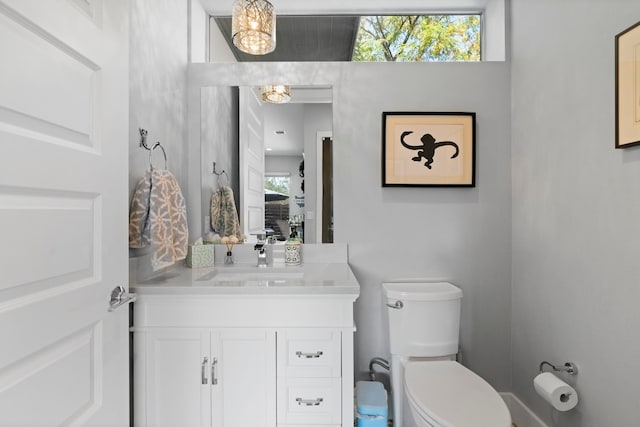 bathroom featuring toilet and vanity