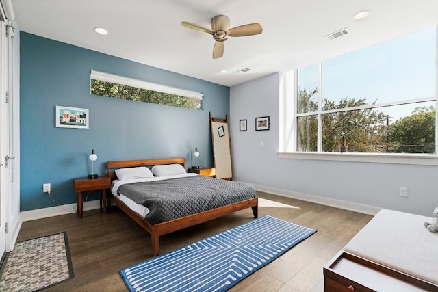 bedroom featuring ceiling fan and dark wood-type flooring