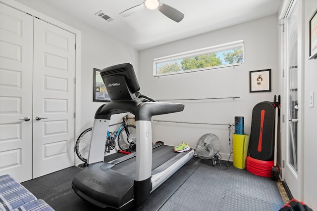 workout room featuring ceiling fan and visible vents
