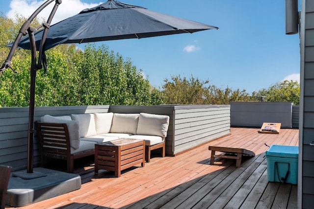 wooden deck featuring an outdoor hangout area