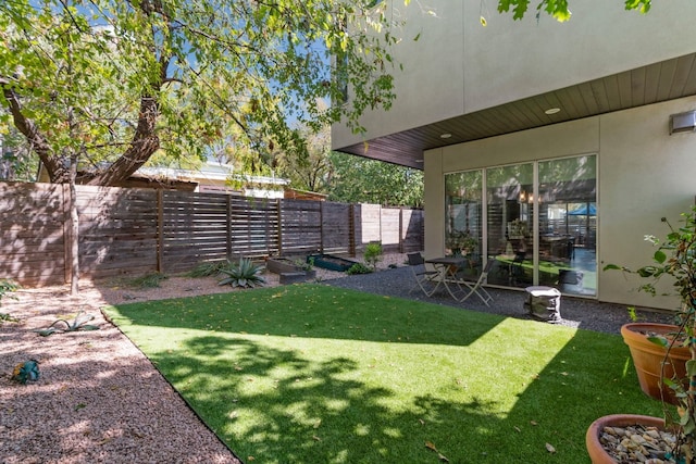 view of yard with a fenced backyard