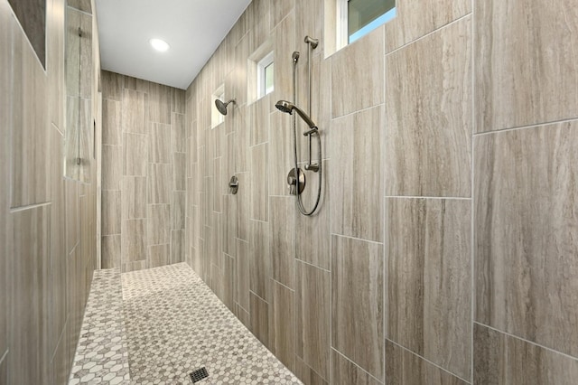 bathroom featuring a tile shower