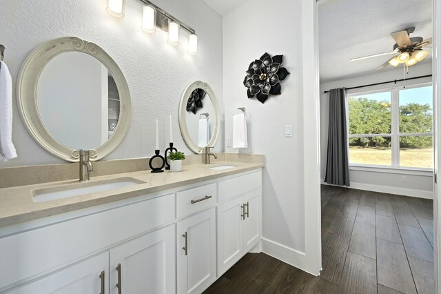 bathroom featuring vanity, hardwood / wood-style flooring, and ceiling fan