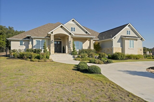 craftsman-style home featuring a front yard