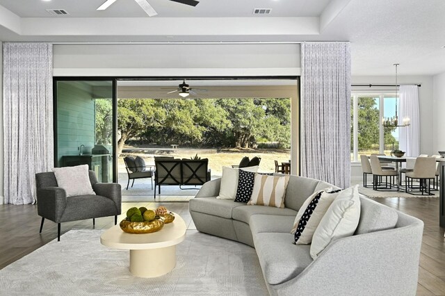 living room with hardwood / wood-style floors and ceiling fan