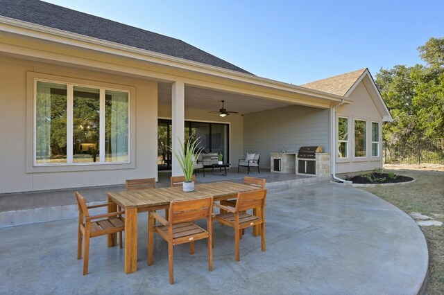 view of patio with an outdoor kitchen, a grill, and ceiling fan