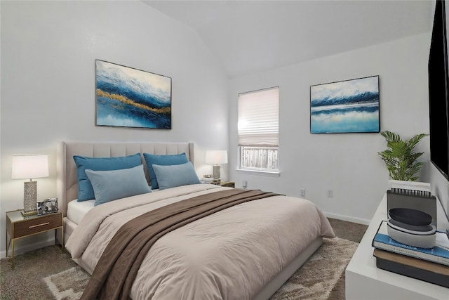 carpeted bedroom with lofted ceiling