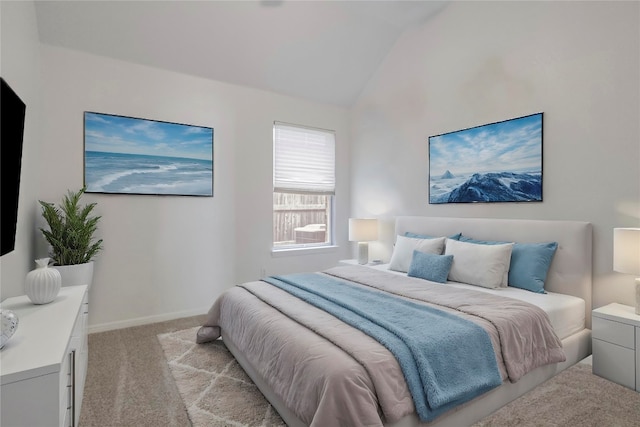 carpeted bedroom featuring vaulted ceiling