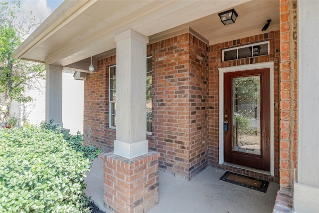 doorway to property featuring covered porch