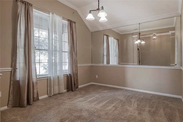 empty room with carpet, vaulted ceiling, an inviting chandelier, and plenty of natural light