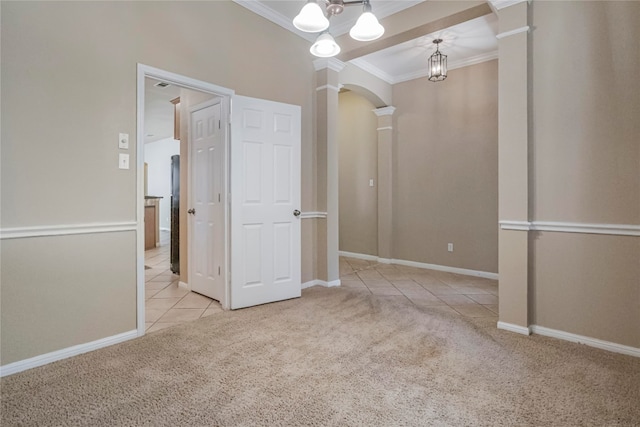 unfurnished room with ornamental molding, decorative columns, light carpet, and a chandelier