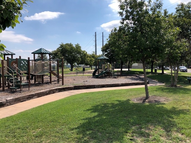 view of jungle gym with a lawn