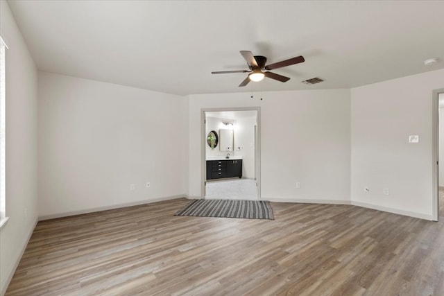 unfurnished living room with light hardwood / wood-style floors and ceiling fan