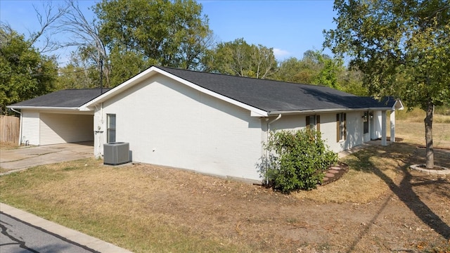 view of property exterior featuring cooling unit and a lawn