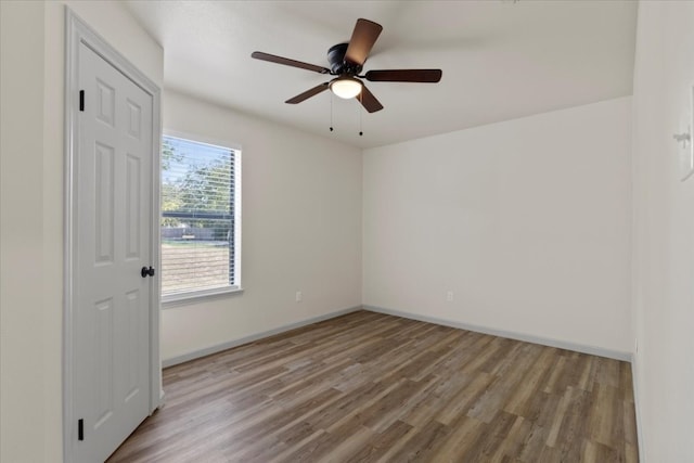 spare room with light hardwood / wood-style flooring and ceiling fan