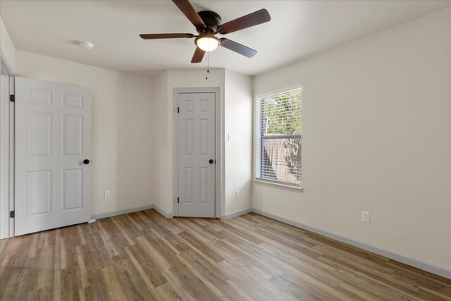 unfurnished bedroom featuring light hardwood / wood-style floors and ceiling fan