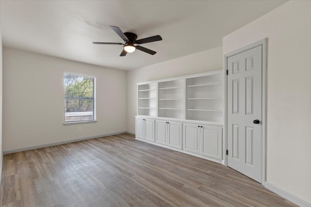 empty room featuring light hardwood / wood-style flooring and ceiling fan