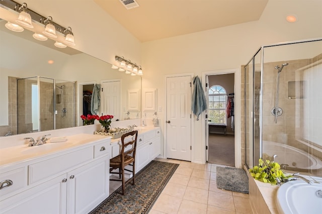 bathroom featuring tile patterned floors, separate shower and tub, and vanity