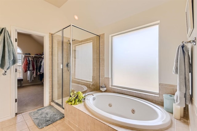 134 Fairwood Dr, Georgetown, TX 78628 - bathroom featuring a stall shower, a whirlpool tub, tile patterned floors, and a spacious closet