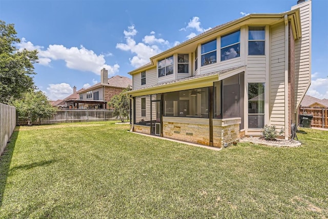 134 Fairwood Dr, Georgetown, TX 78628 - back of property with a sunroom, a fenced backyard, and a chimney