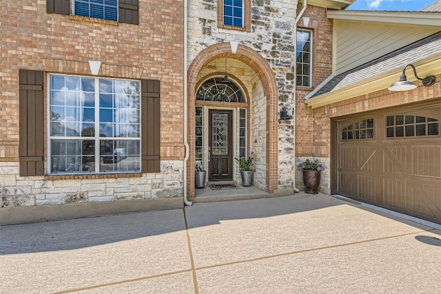 134 Fairwood Dr, Georgetown, TX 78628 - entrance to property with stone siding, driveway, and brick siding