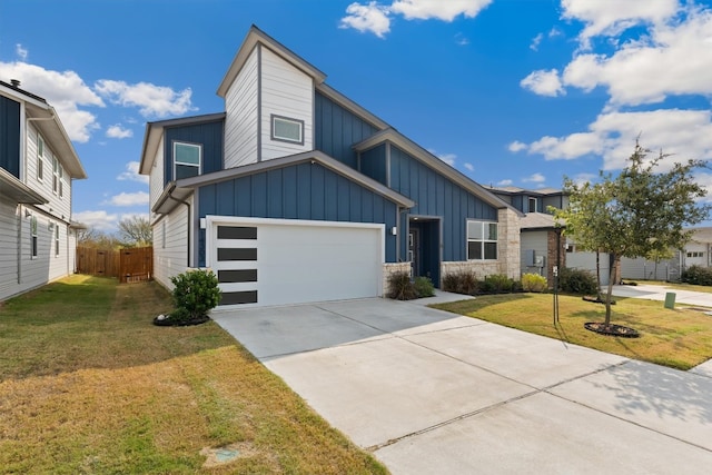 view of front facade featuring a front yard and a garage