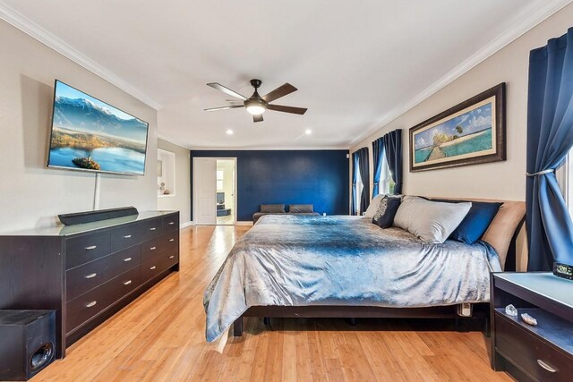 bedroom with ceiling fan, crown molding, and light wood-type flooring