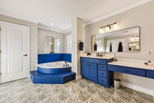 bathroom with vanity, ornamental molding, and tiled bath