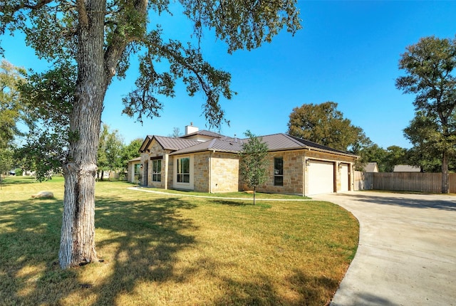 single story home with a front lawn and a garage