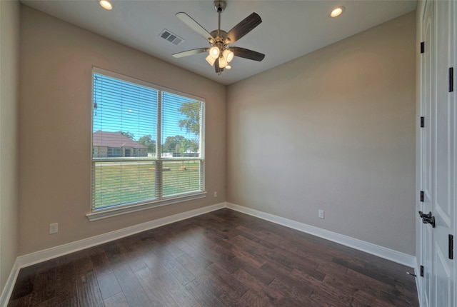 spare room featuring dark hardwood / wood-style floors and ceiling fan