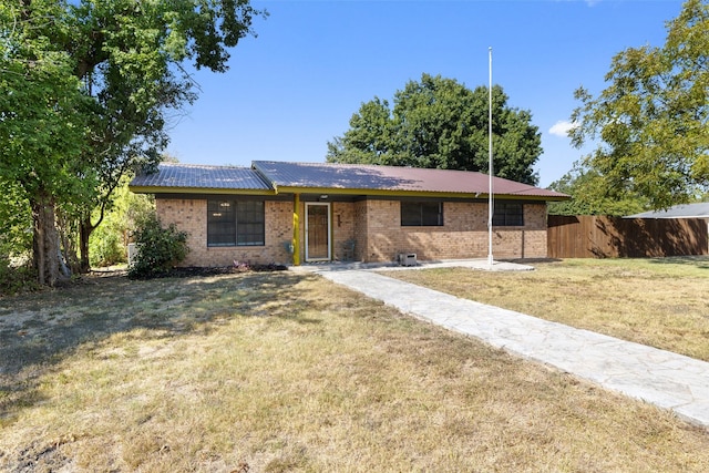 ranch-style home with a front yard