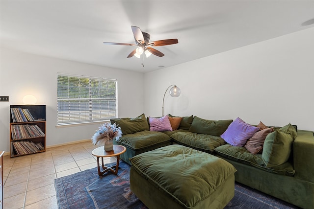 tiled living room with ceiling fan