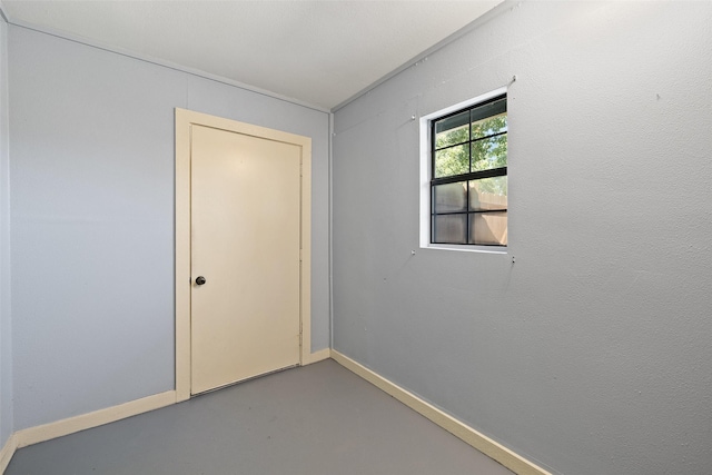 spare room with concrete flooring