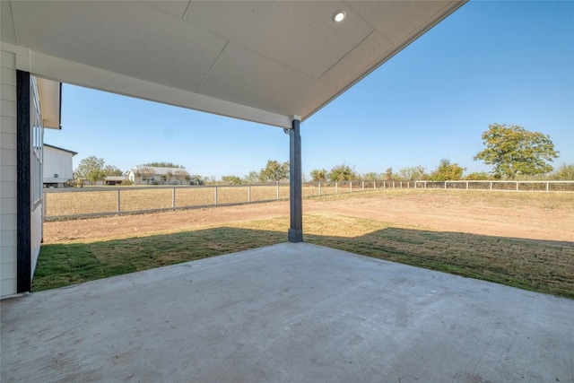 view of patio / terrace with a rural view