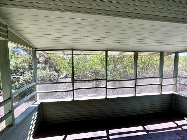 unfurnished sunroom with plenty of natural light