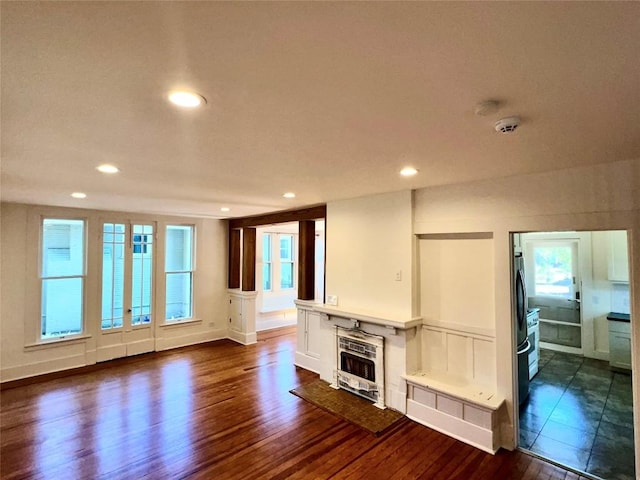 314 Pershing Ave, San Antonio, TX 78209 - unfurnished living room with recessed lighting, dark wood-type flooring, and a fireplace