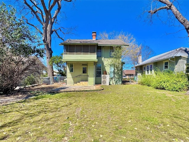 314 Pershing Ave, San Antonio, TX 78209 - rear view of property featuring a yard, fence, a sunroom, and a chimney