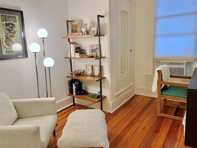 314 Pershing Ave, San Antonio, TX 78209 - living area featuring cooling unit, baseboards, and wood finished floors