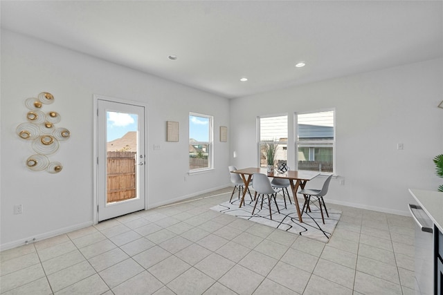 dining area featuring light tile patterned floors