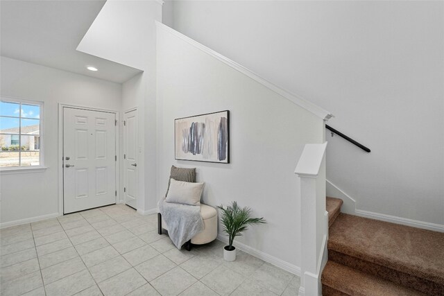 tiled entryway with crown molding