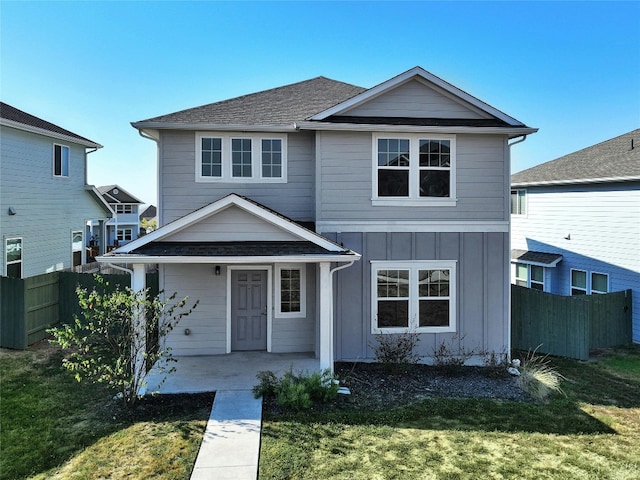 view of property with a front lawn