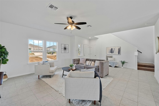 tiled living room featuring ceiling fan