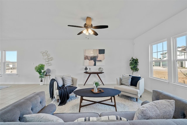 living room featuring ceiling fan and light tile patterned floors