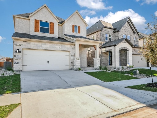 view of front of home featuring a front yard and a garage