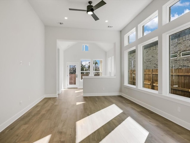 interior space with ceiling fan and wood-type flooring