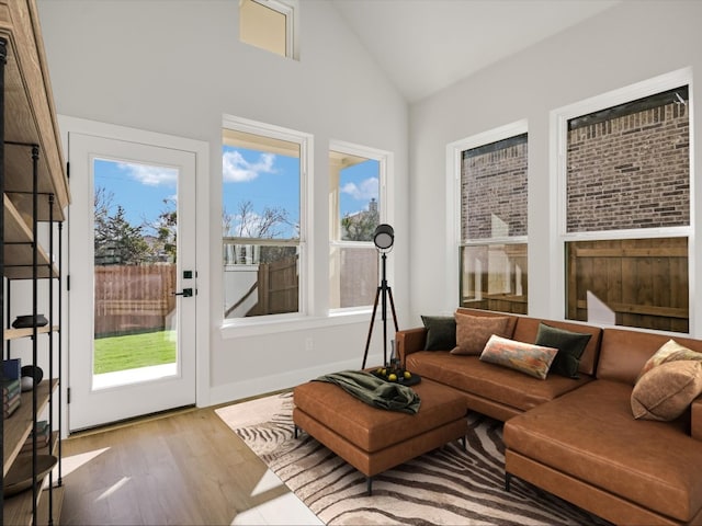 sunroom with lofted ceiling and a wealth of natural light